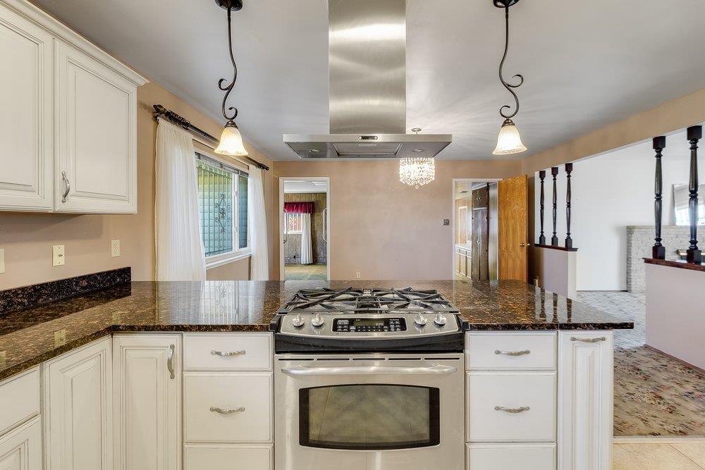 10486 Spaulding Way Rancho Cordova, CA 95670 - Photo 15 of 74 a kitchen with stainless steel appliances granite countertop a sink a stove and a granite counter tops
