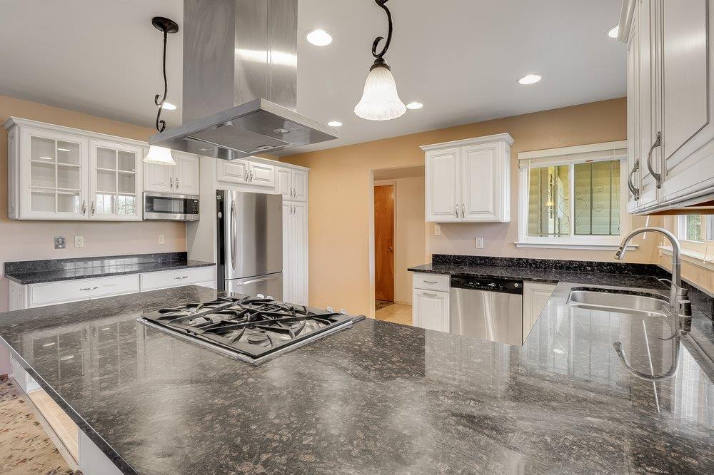 10486 Spaulding Way Rancho Cordova, CA 95670 - Photo 22 of 74 a kitchen with stainless steel appliances granite countertop a refrigerator a sink and a stove