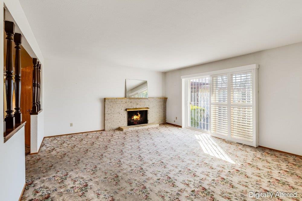 10486 Spaulding Way Rancho Cordova, CA 95670 - Photo 24 of 74 a view of an empty room with a fireplace and a window