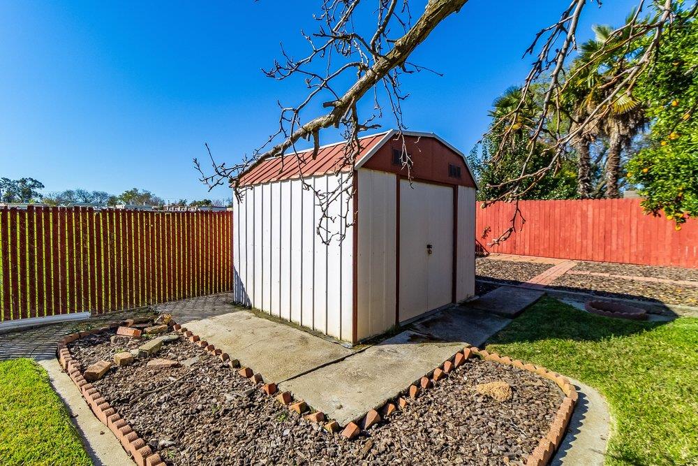 10486 Spaulding Way Rancho Cordova, CA 95670 - Photo 61 of 74 a view of a house with a small yard and wooden fence