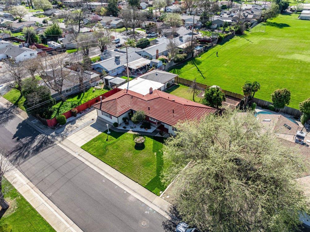 10486 Spaulding Way Rancho Cordova, CA 95670 - Photo 70 of 74 an aerial view of a house with a garden and lake view
