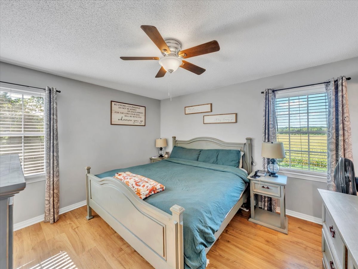 1660 Vales Mill Road Pulaski, TN 38478 - Photo 27 of 35 a bedroom with a bed and a large window
