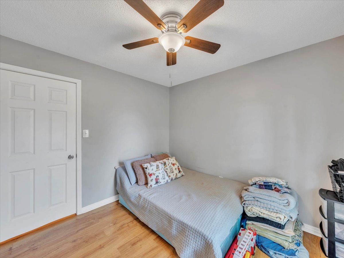 1660 Vales Mill Road Pulaski, TN 38478 - Photo 32 of 35 a bedroom with a bed and a chandelier