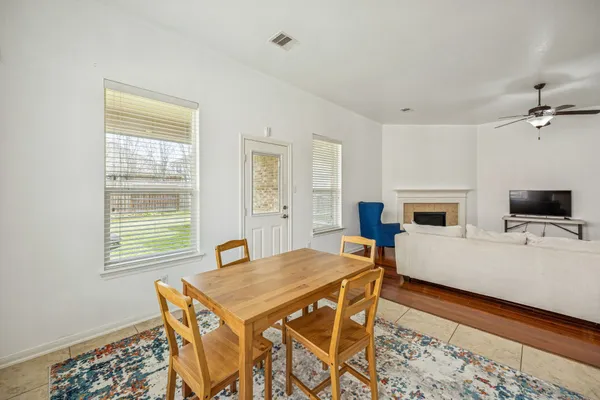 a living room with fireplace furniture and a window