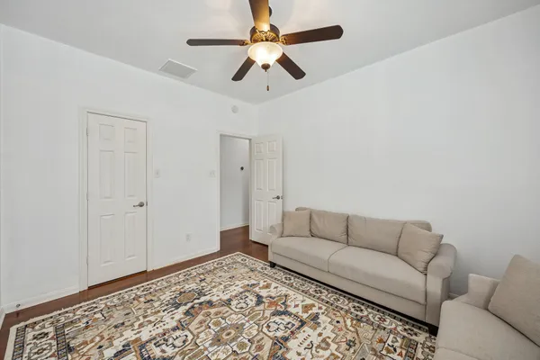 a living room with furniture and a rug