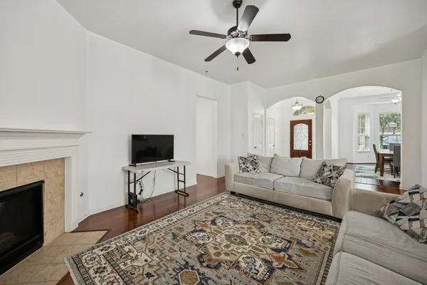 a living room with furniture and a fireplace