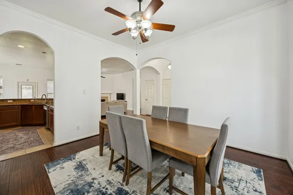 a view of a dining room with furniture and wooden floor