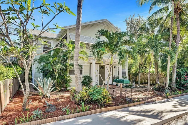 a view of a palm trees in front of a house