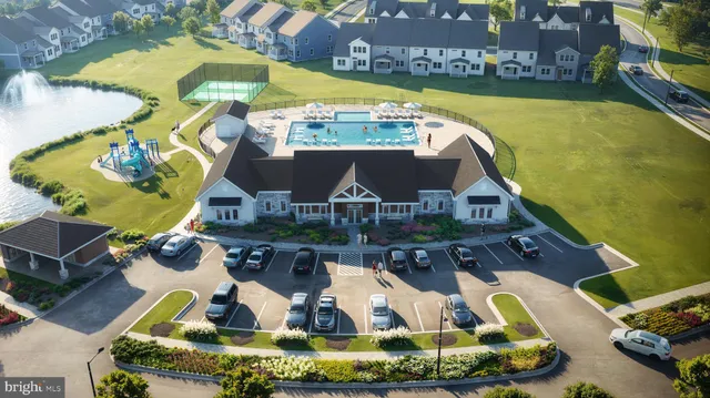 a view of a swimming pool with outdoor seating
