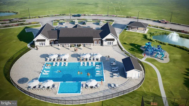 a view of swimming pool with a dining table chairs and potted plants