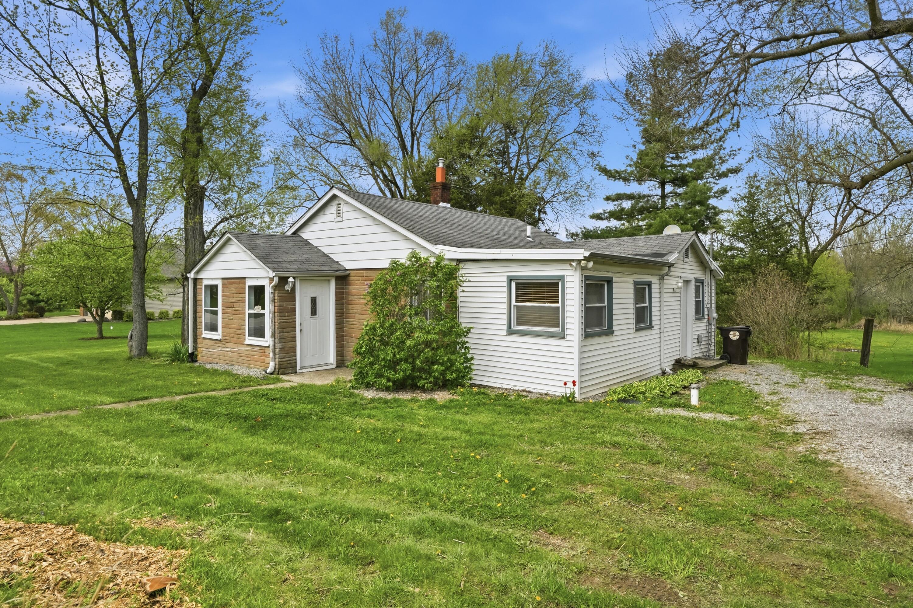 11131 Fathke Road Crown Point, IN 46307 - Photo 2 of 17 a front view of a house with a garden