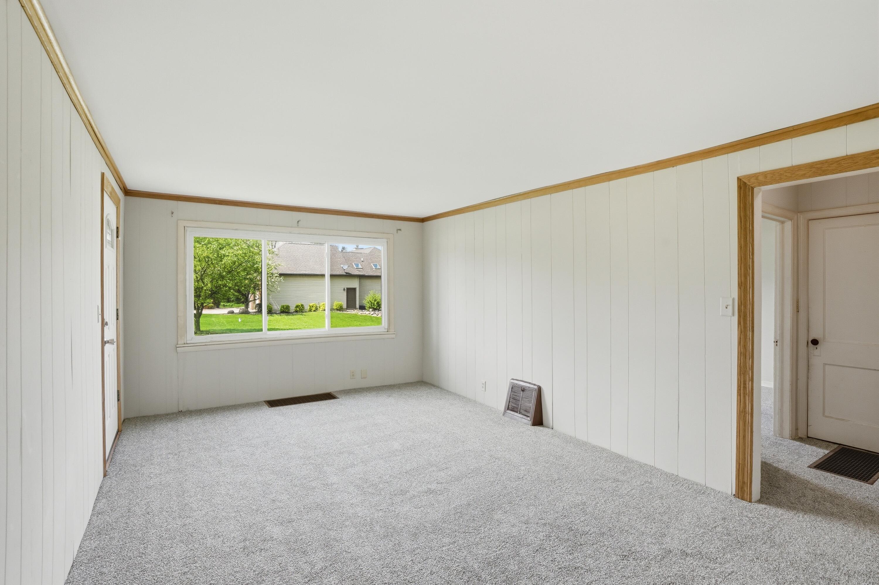 11131 Fathke Road Crown Point, IN 46307 - Photo 4 of 17 a view of an empty room with a window