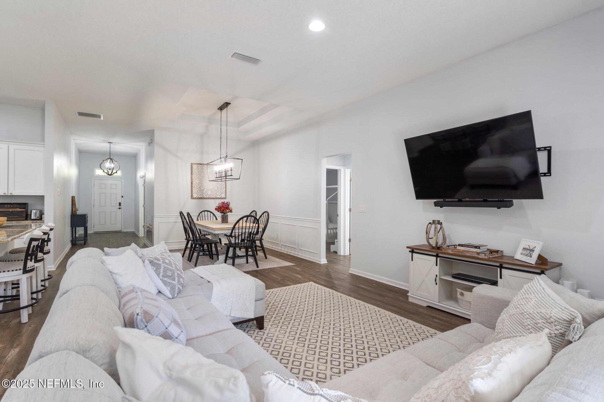 1309 Foxmeadow Trail Middleburg, FL 32068 - Photo 15 of 48 a living room with furniture and a flat screen tv