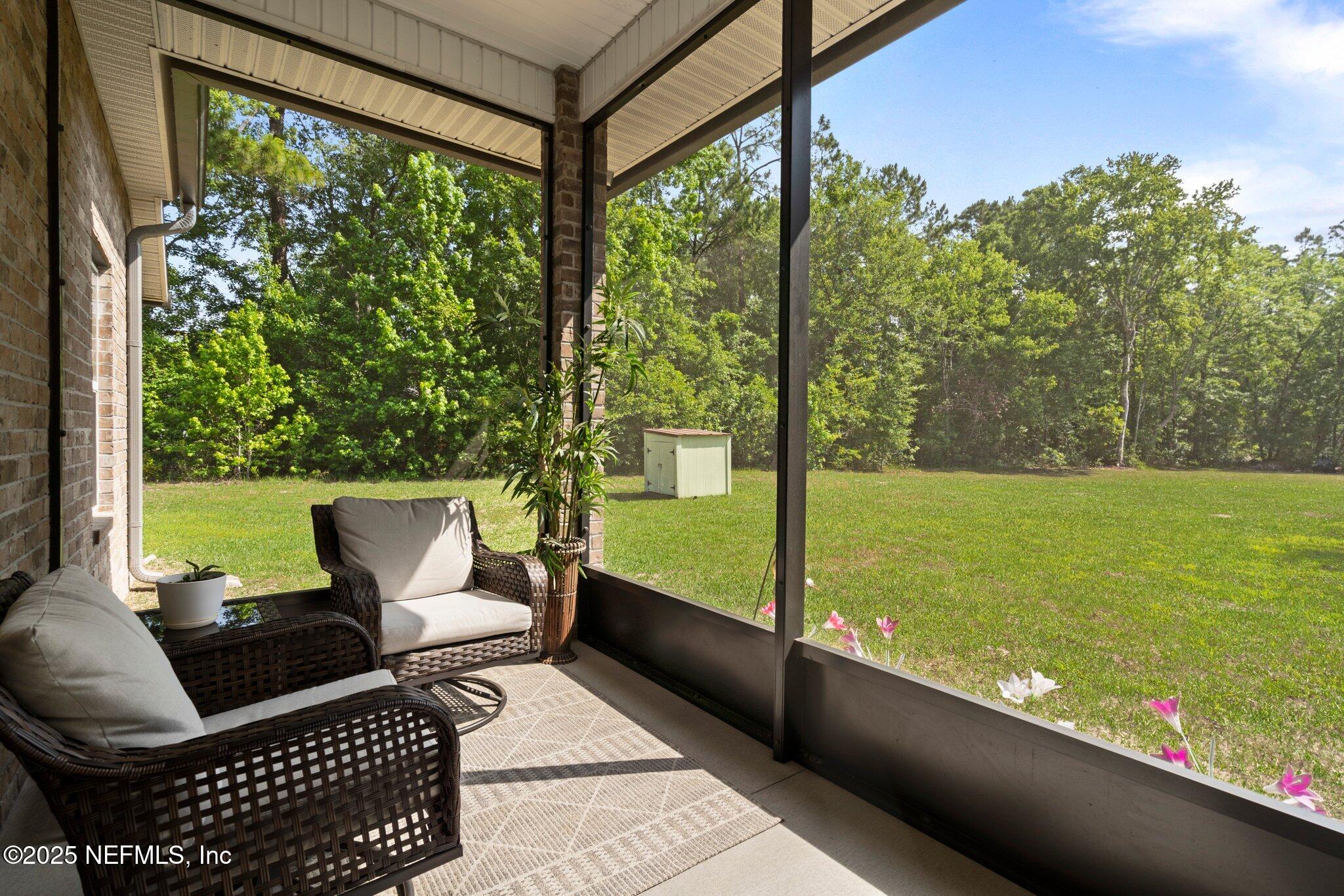 1309 Foxmeadow Trail Middleburg, FL 32068 - Photo 31 of 48 a view of a two chairs in the patio