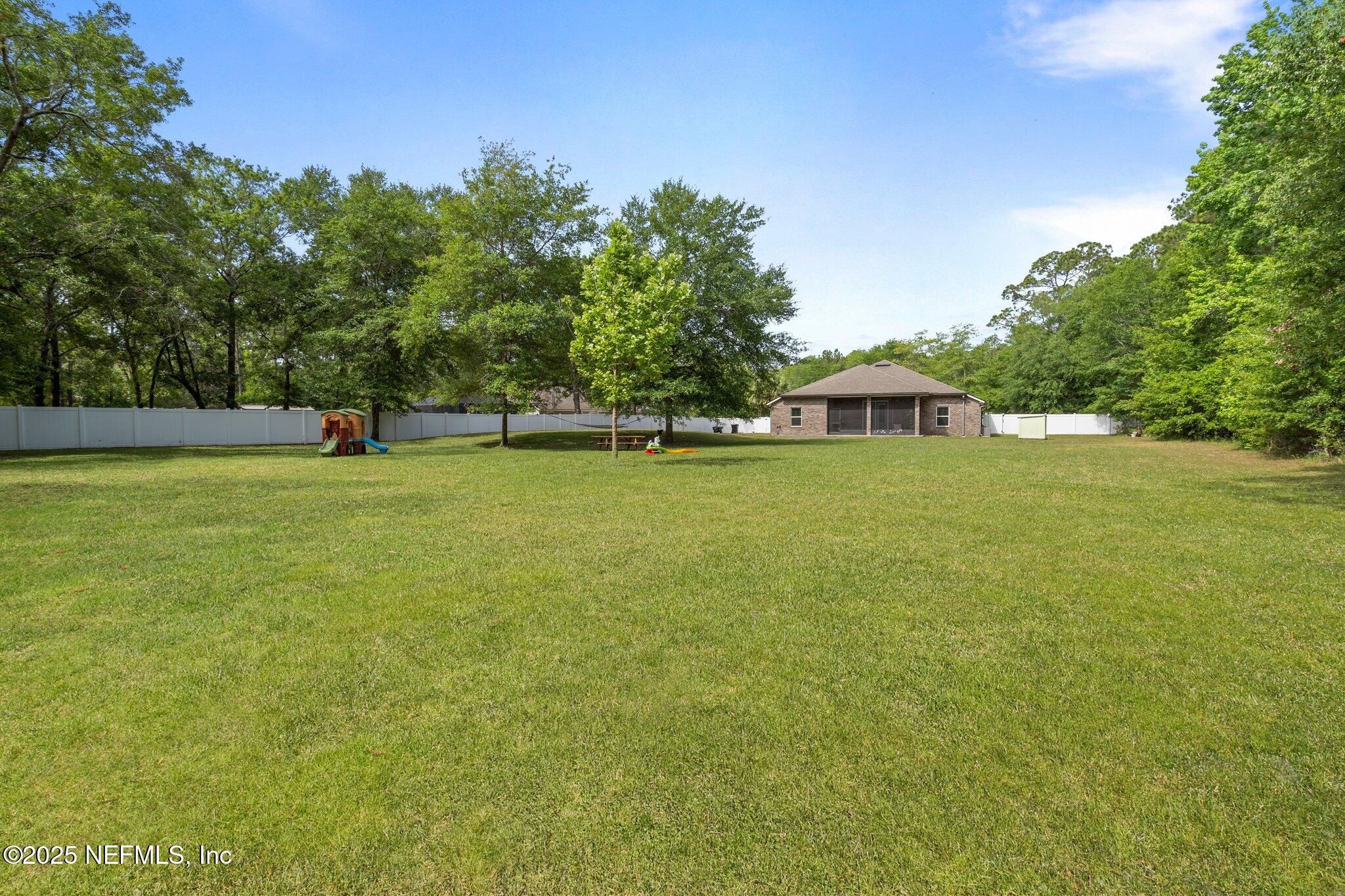 1309 Foxmeadow Trail Middleburg, FL 32068 - Photo 36 of 48 a view of a ocean with a big yard