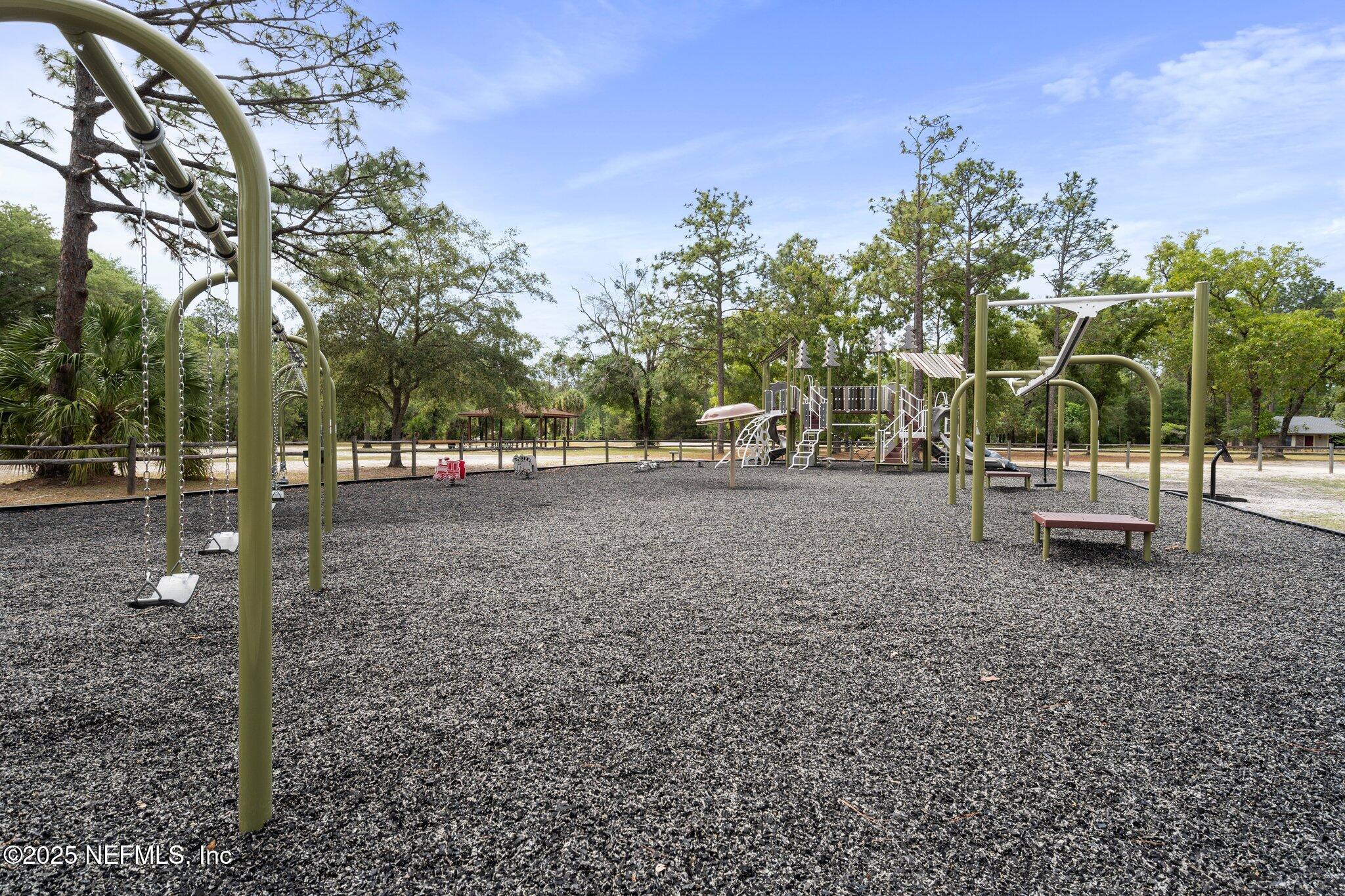 1309 Foxmeadow Trail Middleburg, FL 32068 - Photo 43 of 48 a view of outdoor space with deck and trees