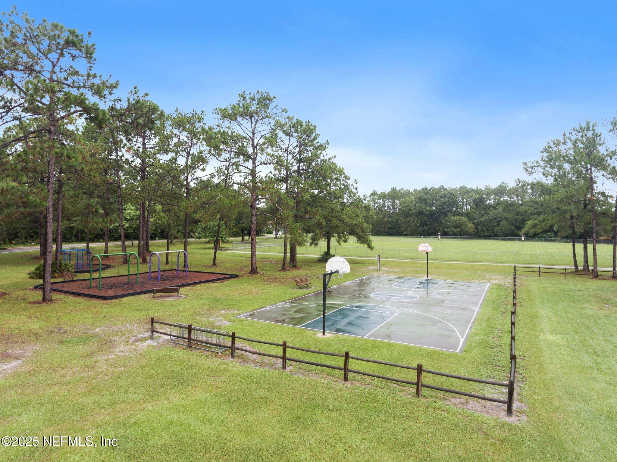 1309 Foxmeadow Trail Middleburg, FL 32068 - Photo 44 of 48 a view of a swimming pool with a bench