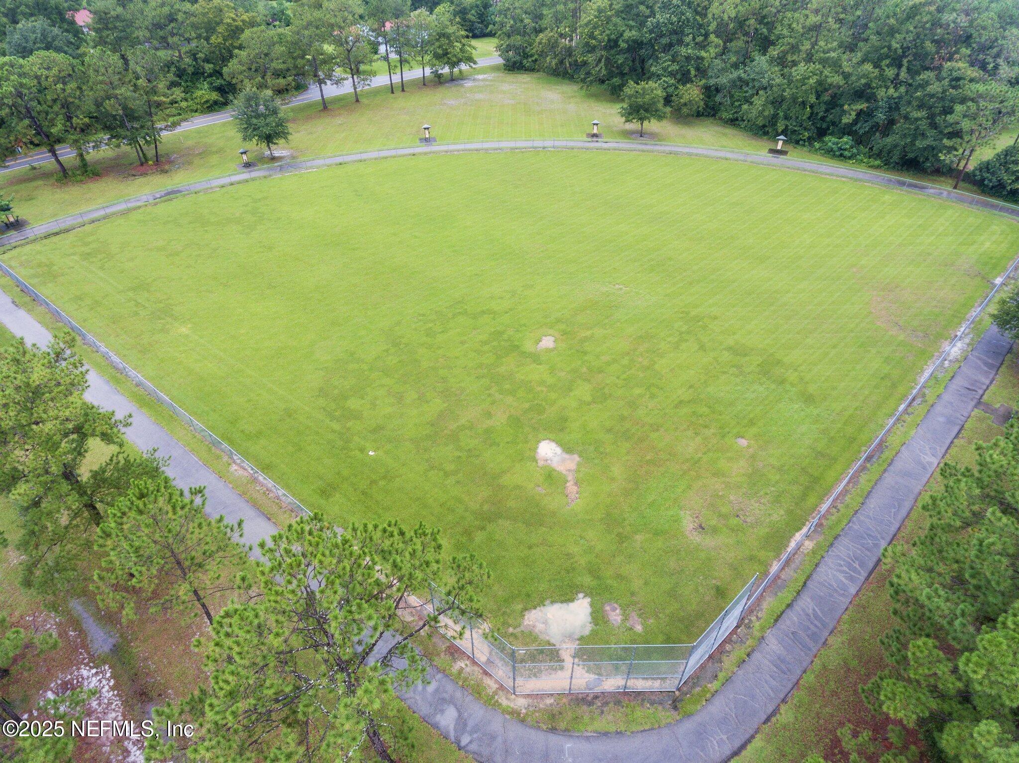 1309 Foxmeadow Trail Middleburg, FL 32068 - Photo 46 of 48 a view of a indoor swimming pool and trees in the background
