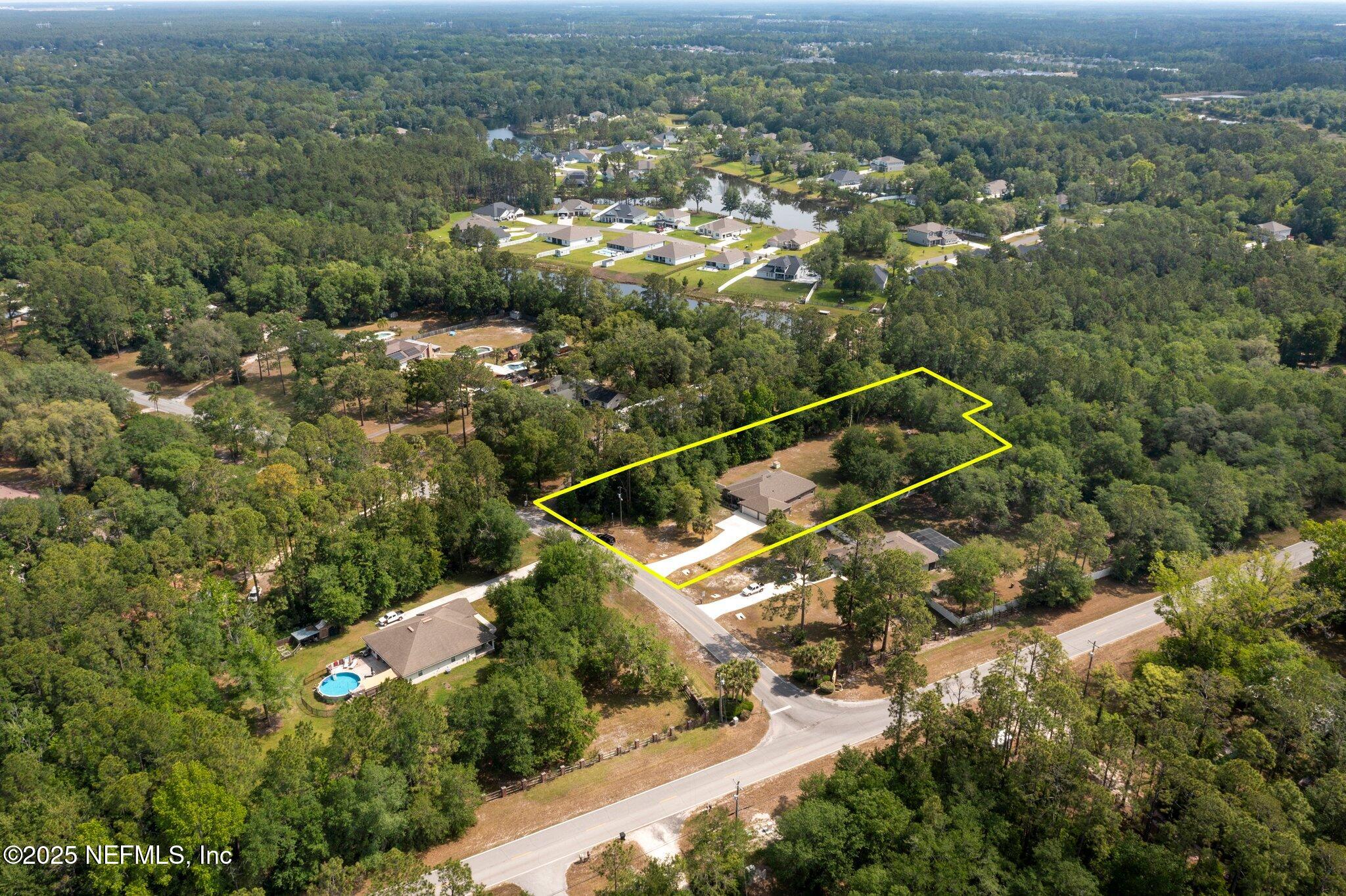 1309 Foxmeadow Trail Middleburg, FL 32068 - Photo 6 of 48 an aerial view of residential house with outdoor space and trees