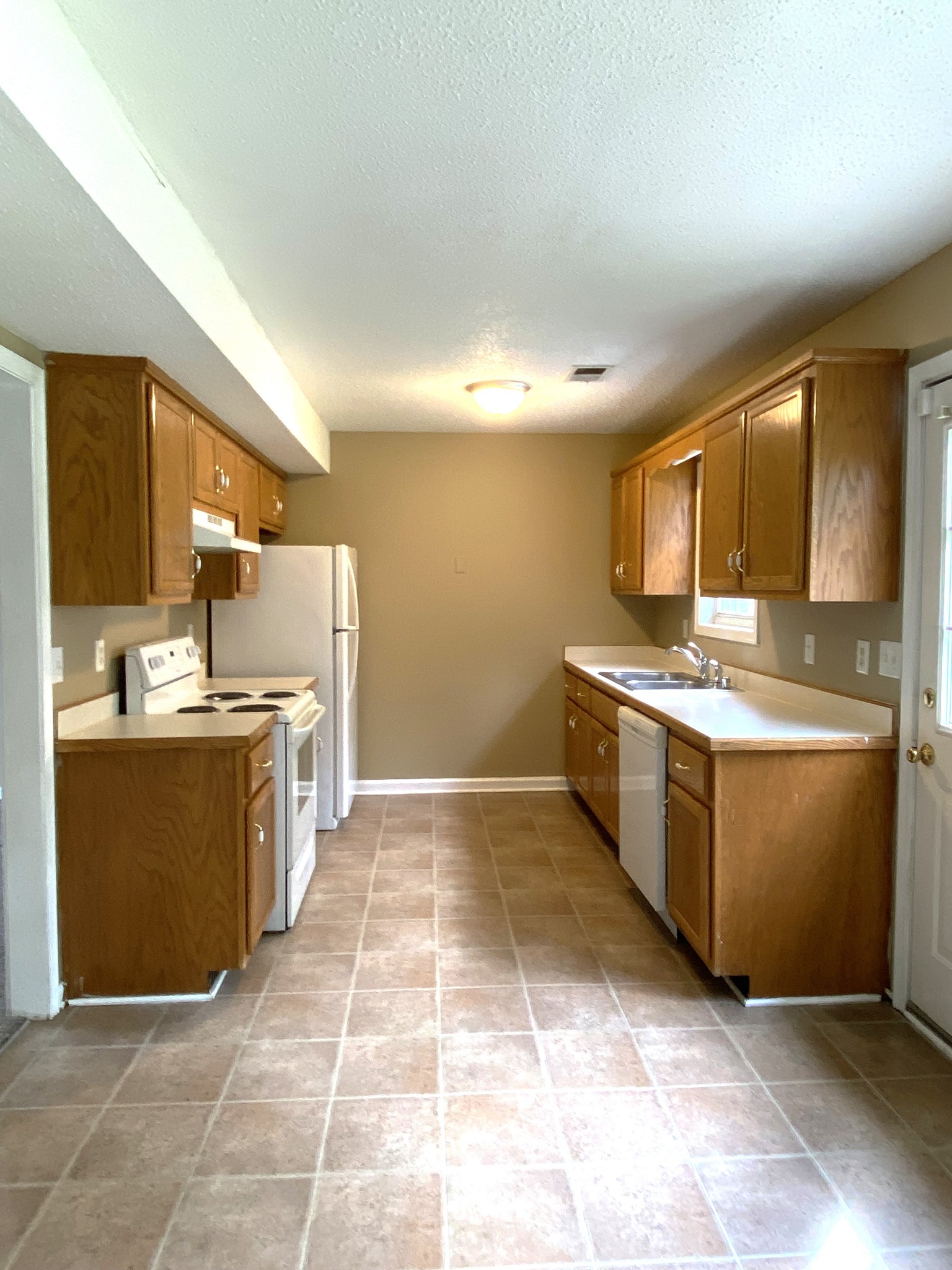 1009 Shadow Ridge Avenue Oak Grove, KY 42262 - Photo 2 of 14 a kitchen with a stove top oven and cabinets