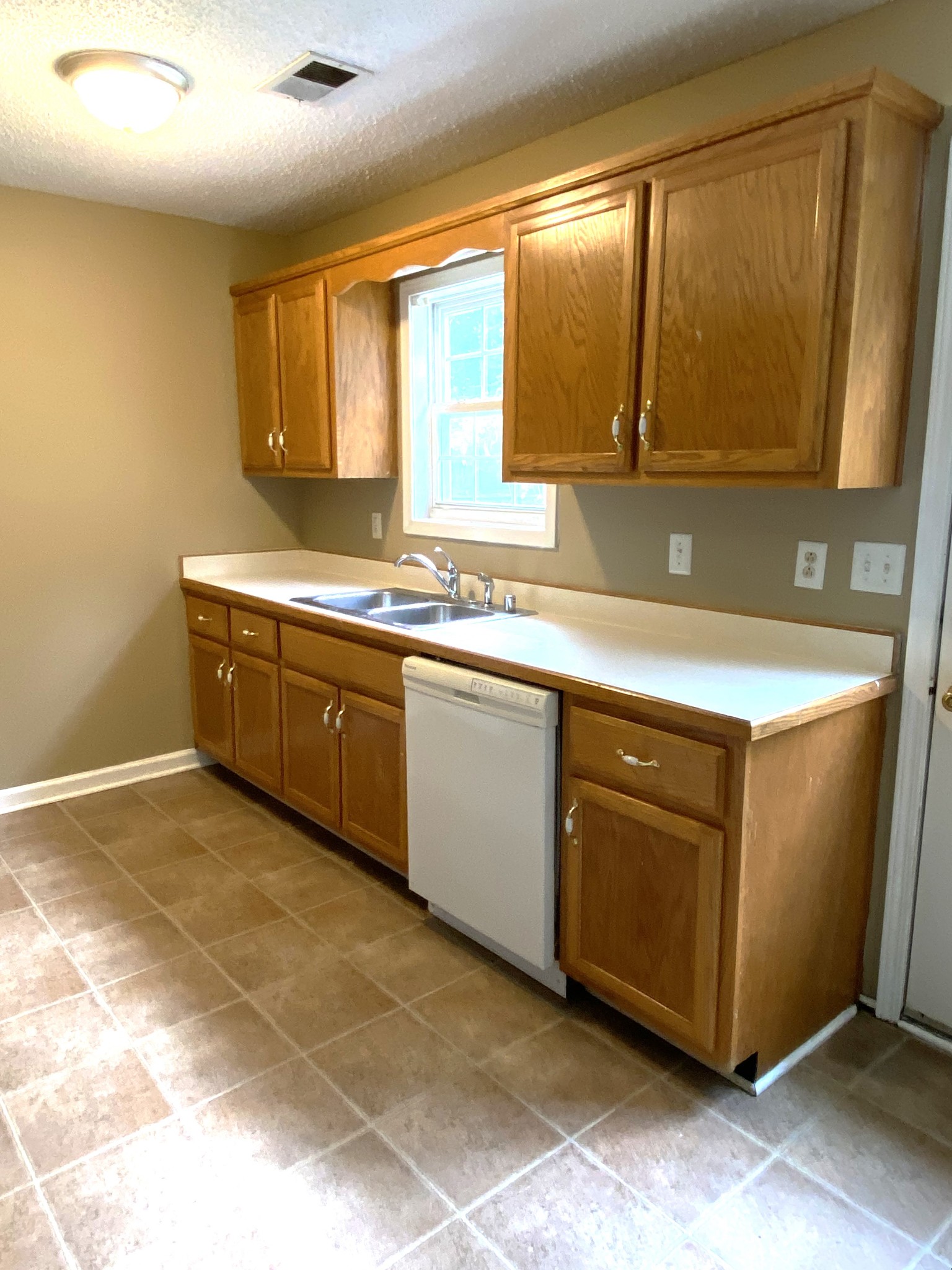 1009 Shadow Ridge Avenue Oak Grove, KY 42262 - Photo 4 of 14 a kitchen with stainless steel appliances granite countertop a sink and a stove