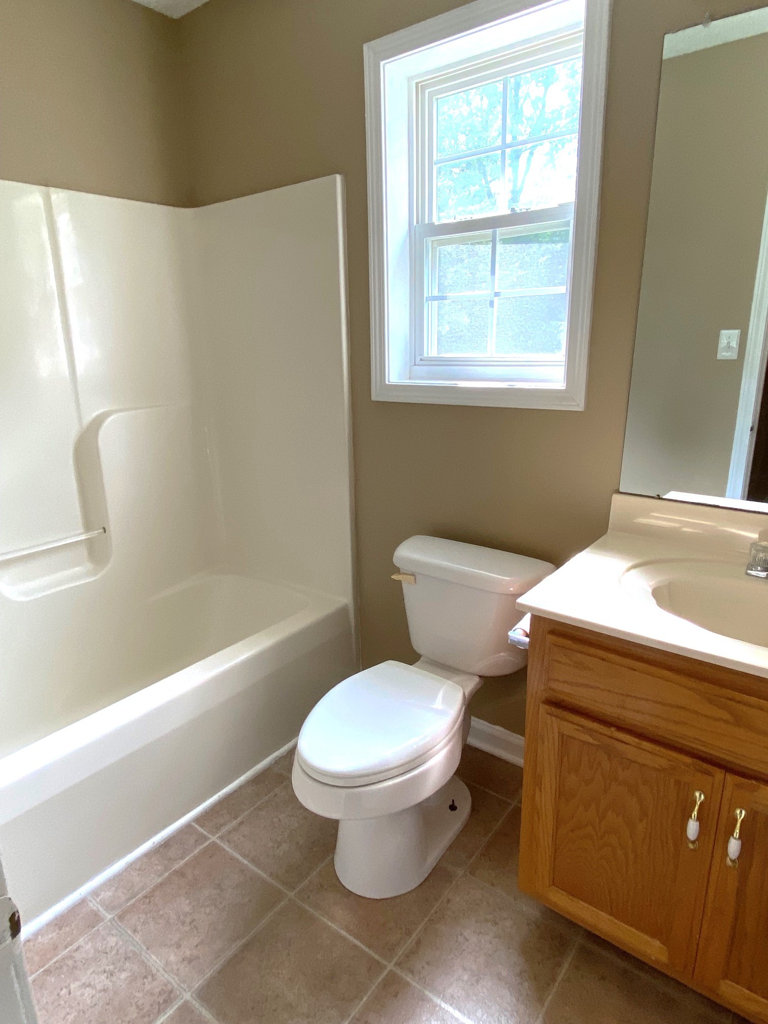 1009 Shadow Ridge Avenue Oak Grove, KY 42262 - Photo 9 of 14 a bathroom with a toilet and a tub