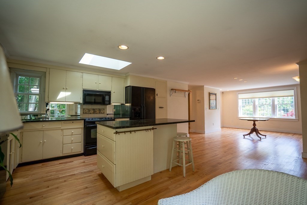 20 Hayward Road Northampton, MA 01062 - Photo 11 of 35 a kitchen with stainless steel appliances granite countertop a sink a stove top oven a counter space and cabinets