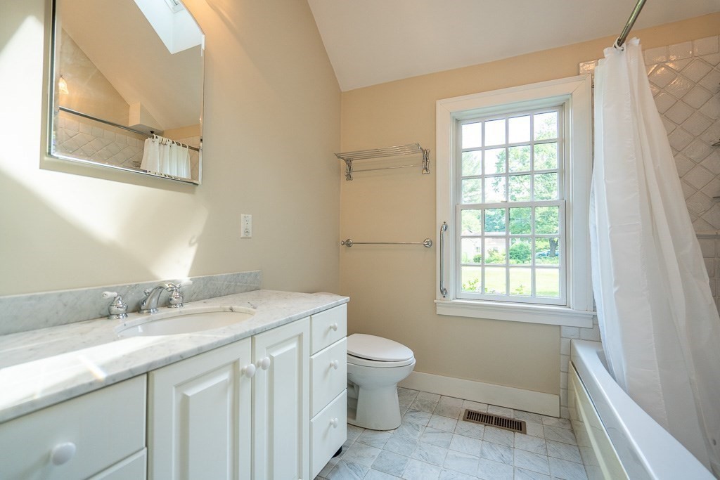 20 Hayward Road Northampton, MA 01062 - Photo 18 of 35 a bathroom with a sink a toilet and a window