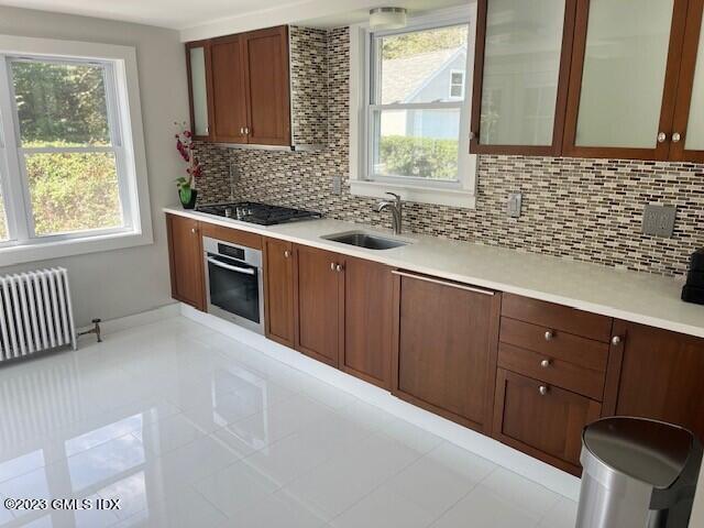 218 Pemberwick Road, Unit 2 Greenwich, CT 06831 - Photo 1 of 20 a kitchen with granite countertop a sink cabinets and window
