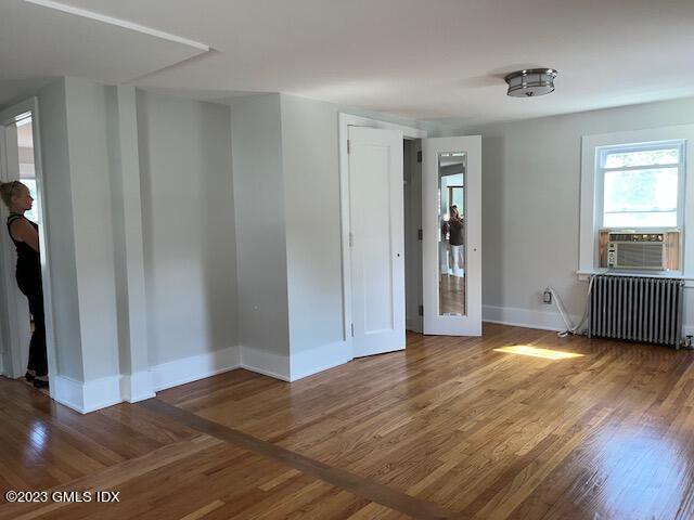 218 Pemberwick Road, Unit 2 Greenwich, CT 06831 - Photo 4 of 20 a view of a livingroom with wooden floor and closet