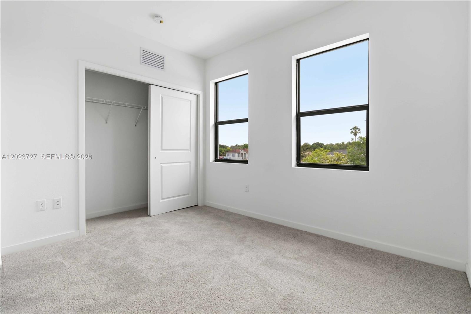 22348 Southwest 115th Court, Unit 22348 Miami, FL 33170 - Photo 11 of 37 an empty room with windows