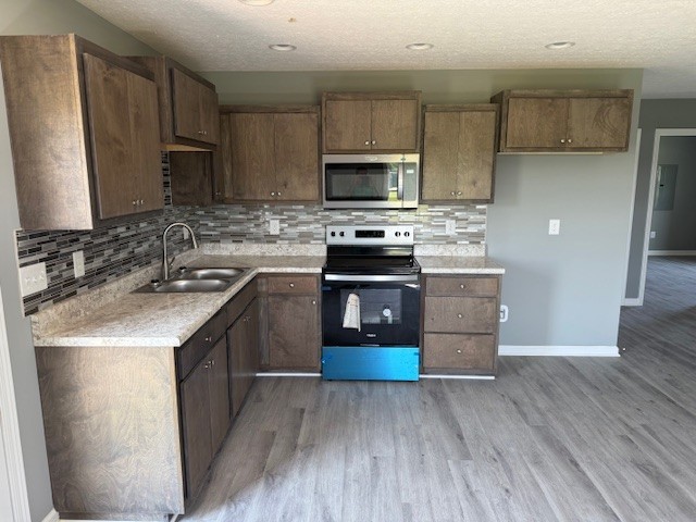 12 Hesselly Road Decherd, TN 37324 - Photo 3 of 12 a kitchen with wooden cabinets and stainless steel appliances