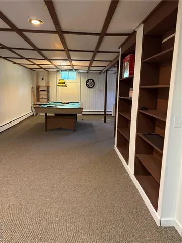 a view of a room with furniture wooden floor and window
