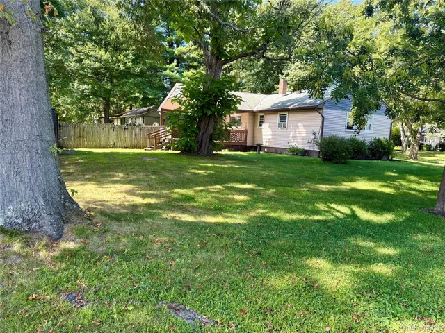 a view of a yard with large tree