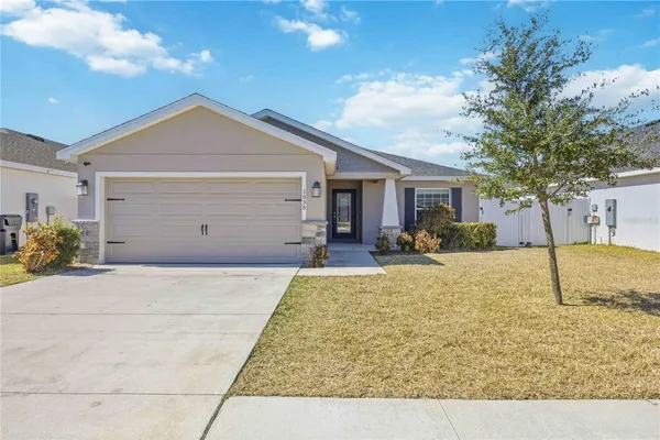 a view of a house with snow on the background
