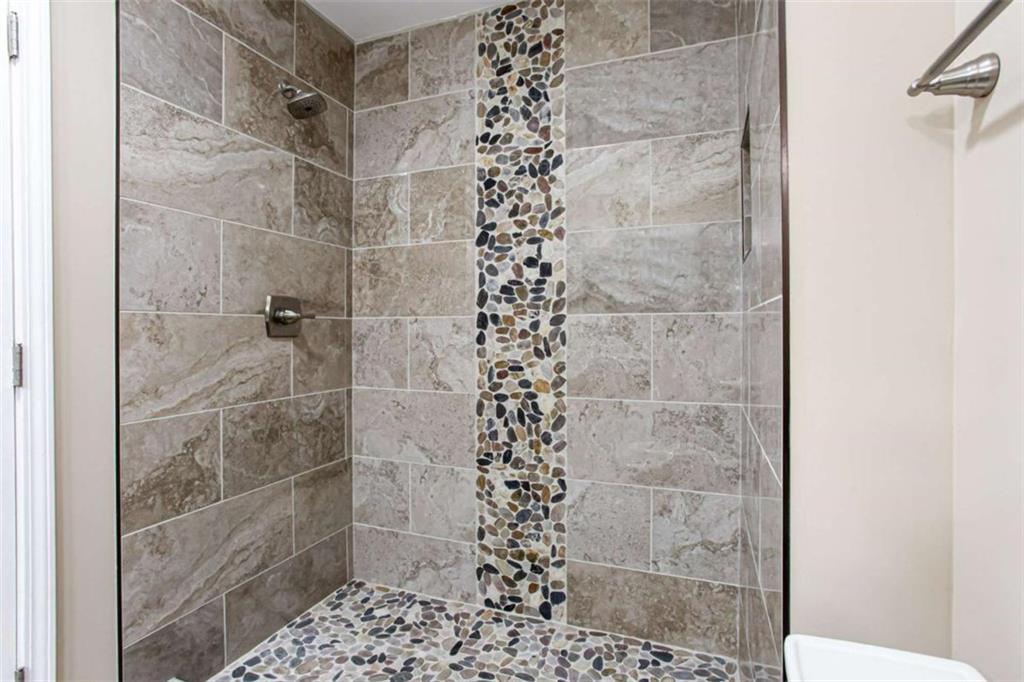 3721 Bogan Mill Road Northeast Buford, GA 30519 - Photo 50 of 58 a bathroom with a shower