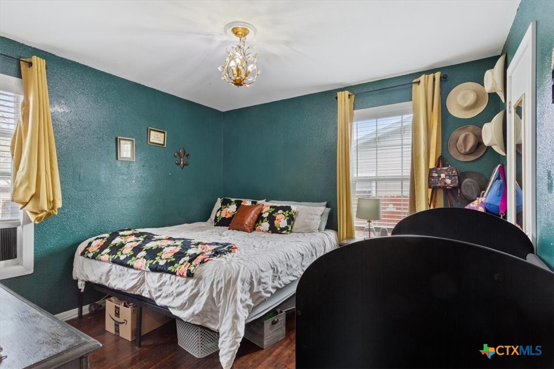 2909 June Street Killeen, TX 76543 - Photo 14 of 20 a bedroom with a bed and painting on the wall