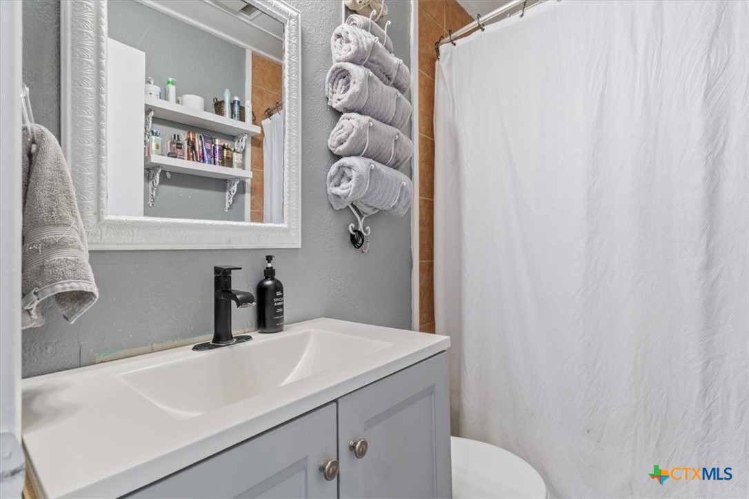 2909 June Street Killeen, TX 76543 - Photo 16 of 20 a bathroom with a sink and a toilet