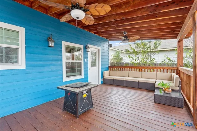 a view of a chairs and table in the patio