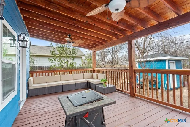 a balcony with wooden floor