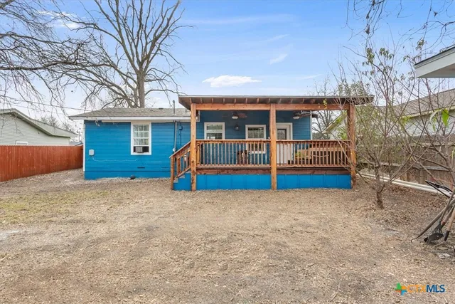 a house with a tree in the background