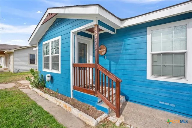 a front view of a house with a porch