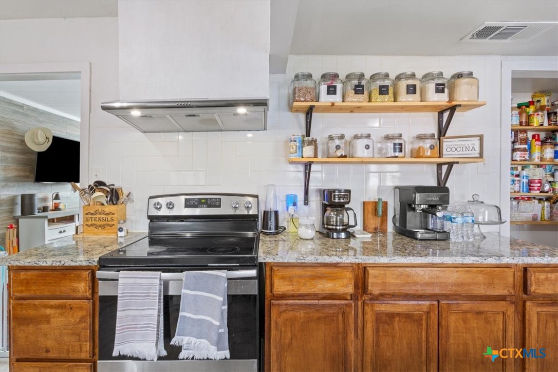 2909 June Street Killeen, TX 76543 - Photo 10 of 20 a kitchen with a sink and a stove