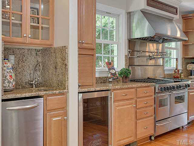 Convenient Ice Maker, Wine Cooler & Abundant Cabinetry