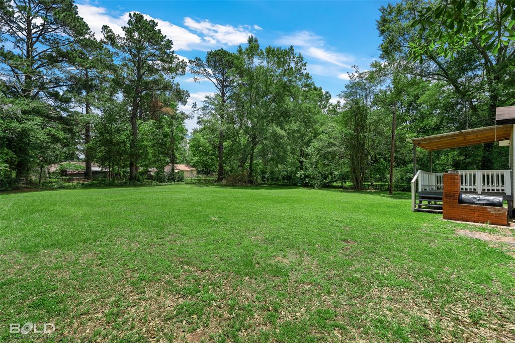 115 Pam Street Mansfield, LA 71052 - Photo 24 of 25 a view of backyard with sitting area