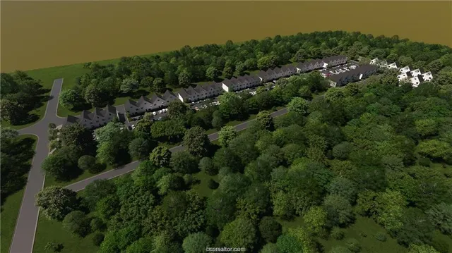 an aerial view of residential house with outdoor space and trees all around