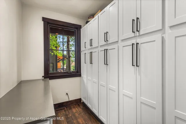 a bedroom with a large bed and a large window