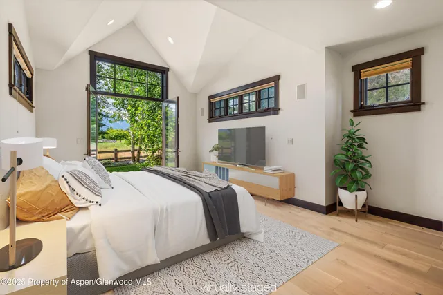 a view of a dry yard with mountains in the background
