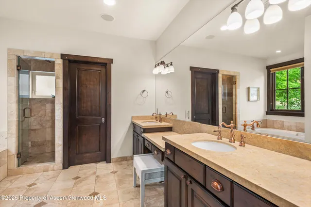 a view of a house with a big yard and large trees