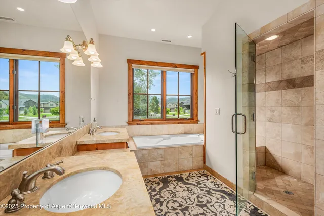 an aerial view of a house with a garden and plants